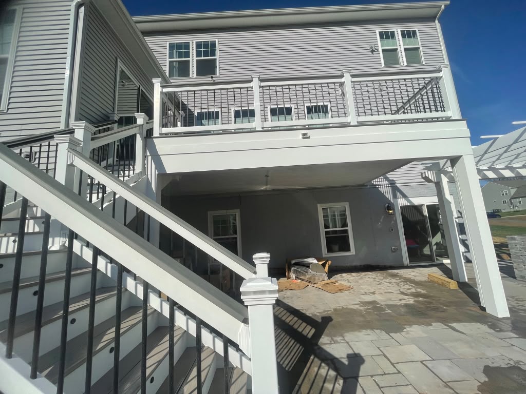 Outdoor deck with elevated structure and railings