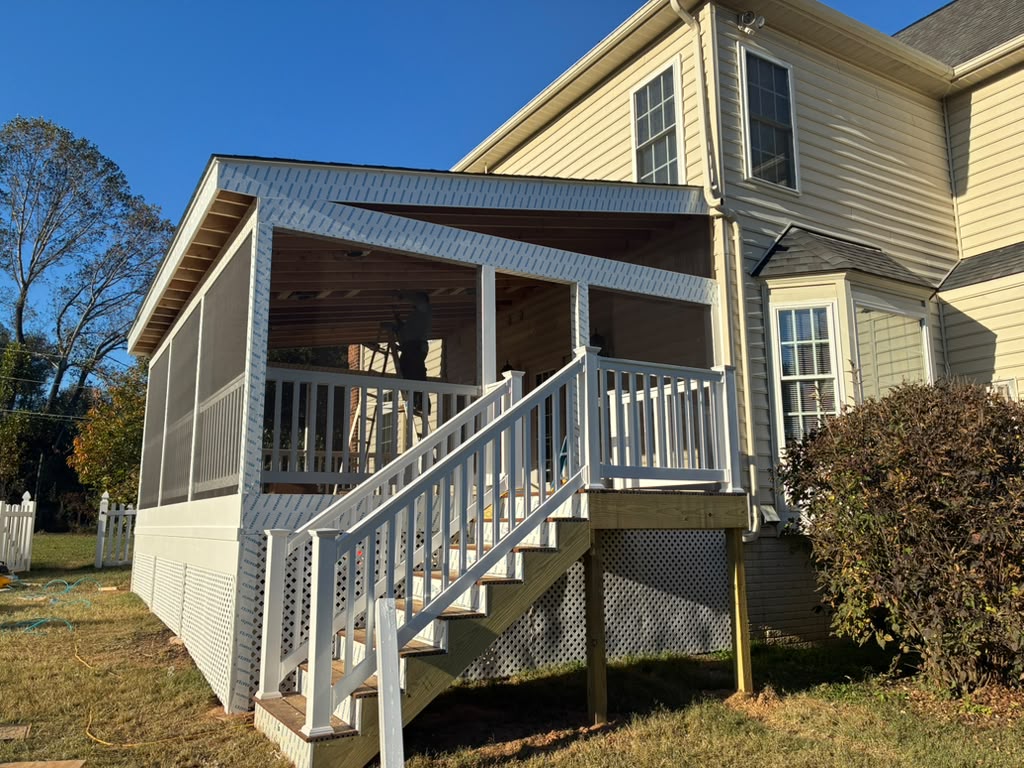 Outdoor deck with covered structure and stairs