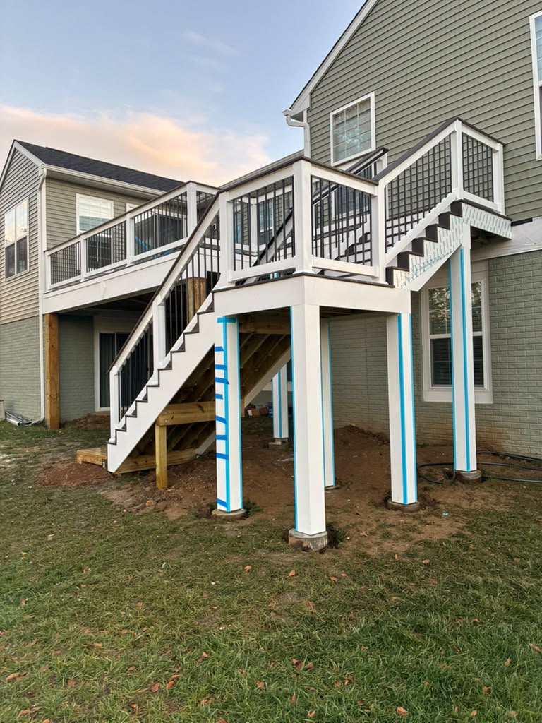 Deck structure with stairs and white supports